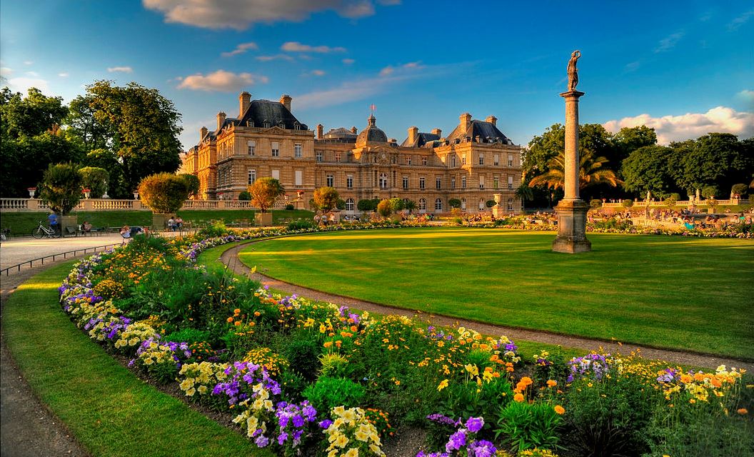 French Baroque architecture Luxembourg Palace with park with manicured lawns & statues